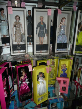 Display of Vintage Barbies in Glass Case